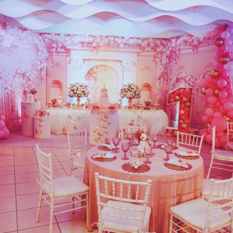 Table and chairs set up for a birthday party