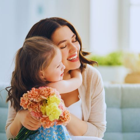 Mother and daugher hugging each other