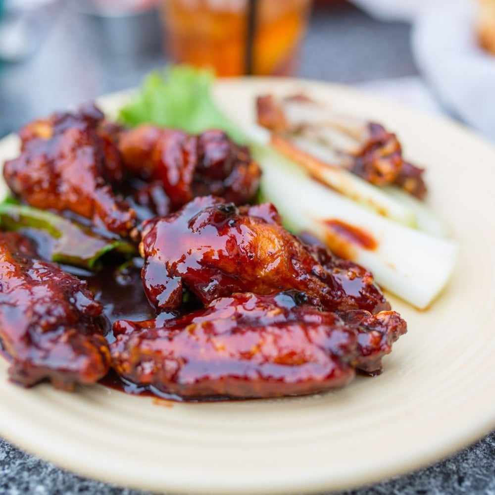 wings with bbq sauce on a plate