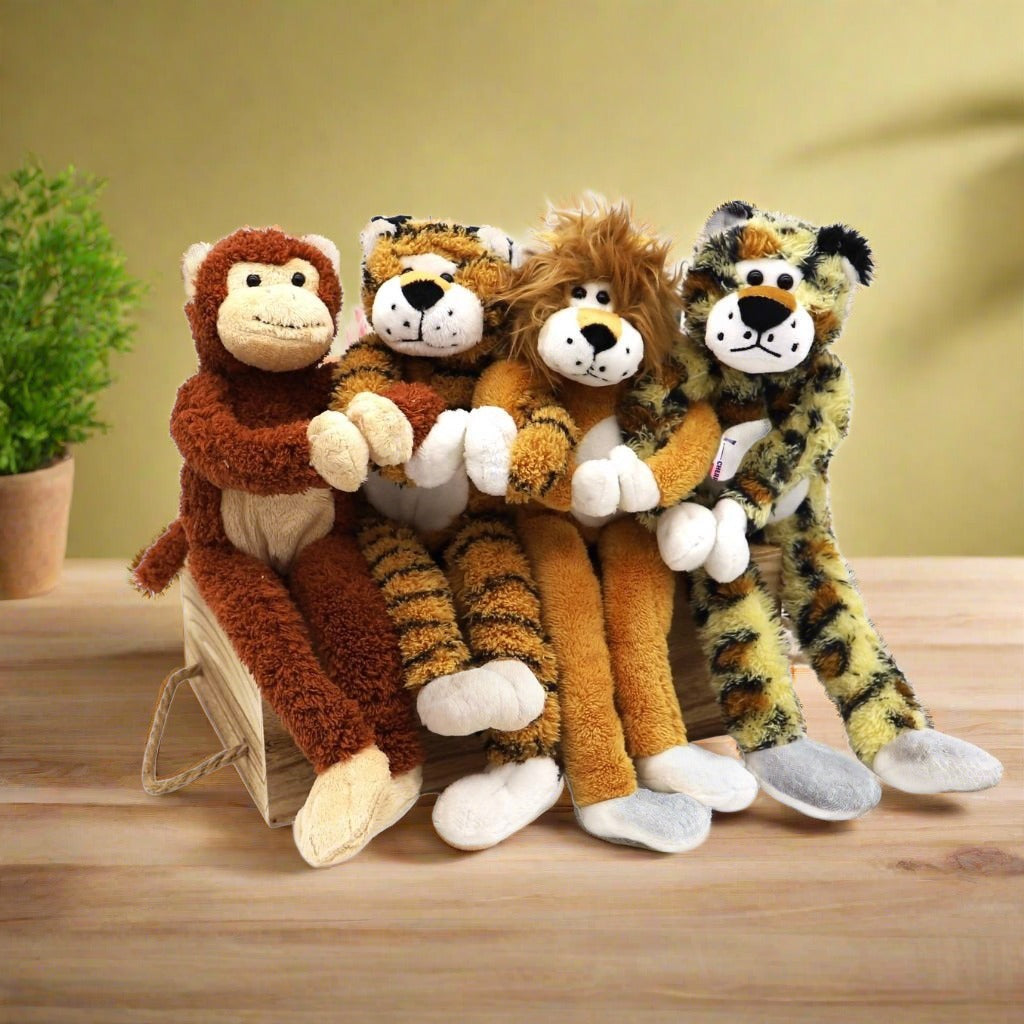 Four adorable jungle animal plushies - tiger, cheetah, monkey, and lion - included in the Wild About You gift basket, perfect for Valentine’s Day.